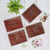 A set of four Indra Medium Embossed & Stitched Leather Photo Albums with Semi-Precious Stone. Available in lapis, tiger's eye, labradorite and black onyx.