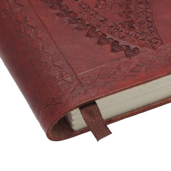 Close-up of the Medium Brown Embossed Notebook with a textured cover. A brown ribbon bookmark is visible, adding elegance to this beautifully designed notebook.