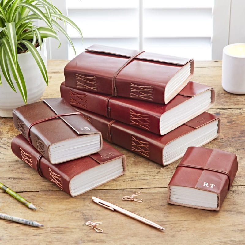 Naturally dyed, handmade Personalised Distressed Leather Journals in a range of sizes. Personalised on the leather flap.