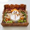 A Natural Mango Wood tea tray with cheese shaped like a snowman, grapes, nuts and pretzels.