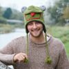 A man wearing a Frog Woollen Animal Hat.