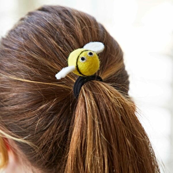 A woman's ponytail with a Pack of 3 Felt Bee Hair Bands.