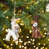 Two Felt Reindeer Christmas Decorations hanging from a tree.