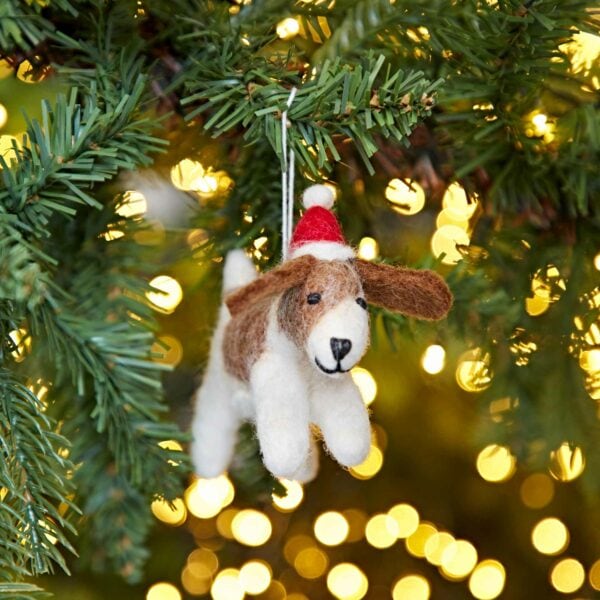 A Felt Christmas Fido Dog Hanging hanging from a Christmas tree.