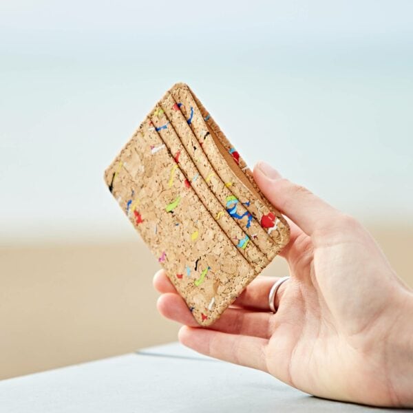A person showcasing a Natural Cork Credit Card Holder.