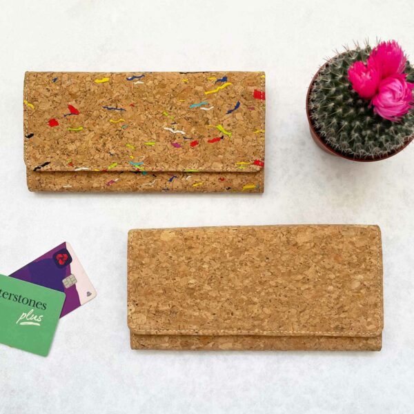 A Natural Cork Clutch Purse with a cactus next to it.
