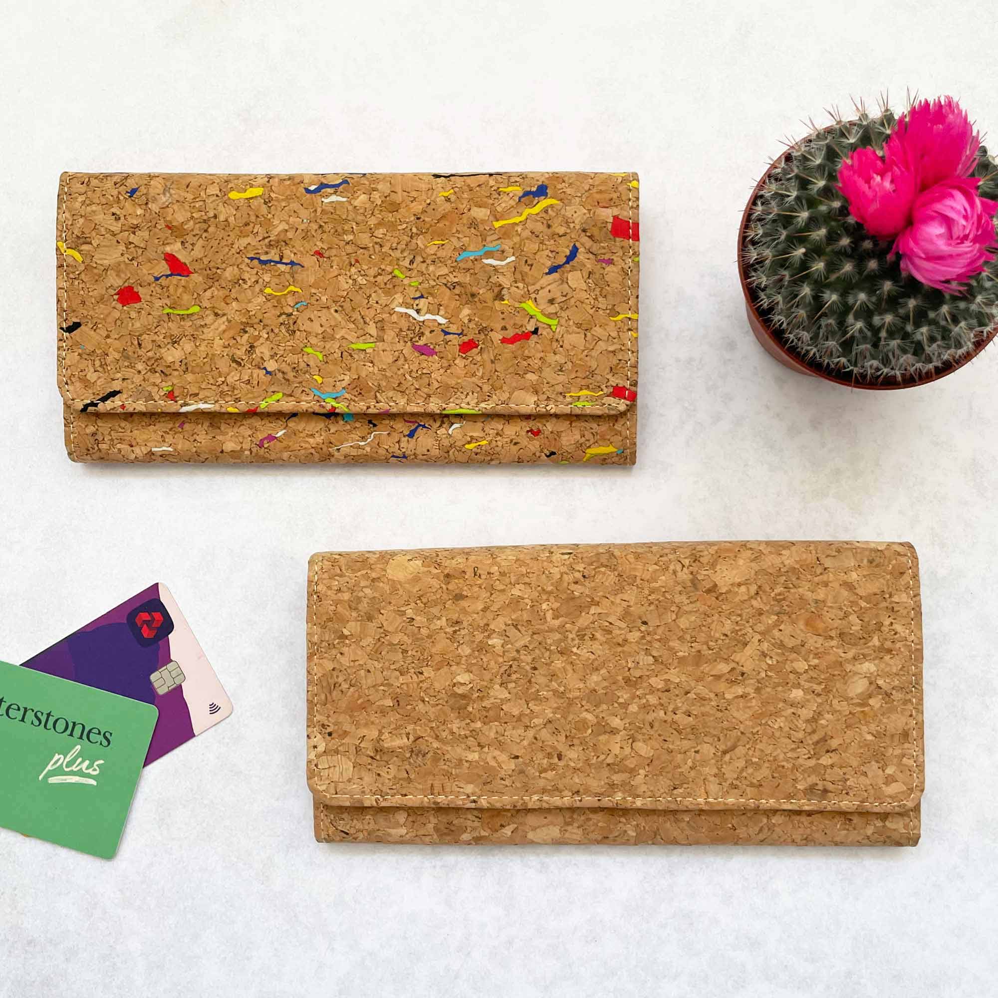 A Natural Cork Clutch Purse with a cactus next to it.