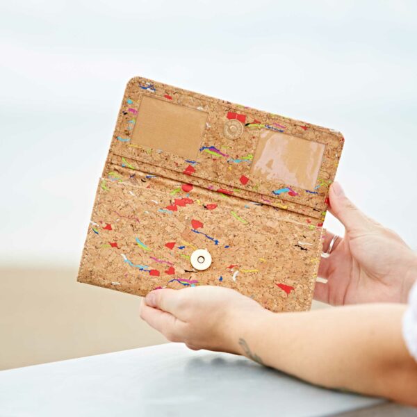 A person holding a Natural Cork Clutch Purse.