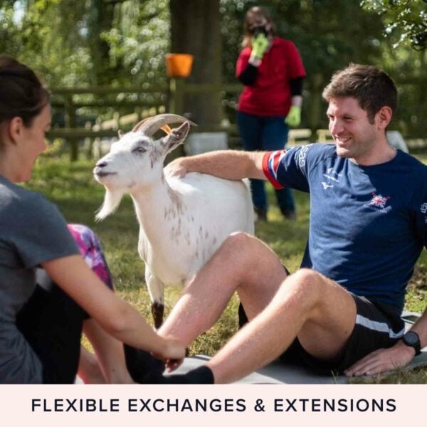 Two people sit on the grass interacting with a white goat, reminiscent of Goat Yoga for Two in the Suffolk Countryside, while a gardener works in the background. Text reads “Flexible Exchanges & Extensions.”