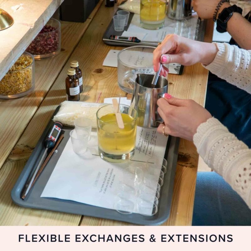 Several participants joined the Candle Making Workshop with Cream Tea for Two at Laura Fisher Limited, carefully mixing their supplies laid out on a table. Text overlay reads, "Flexible exchanges & extensions."