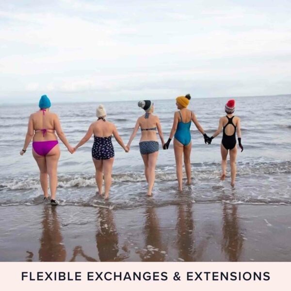 Two people holding hands, dressed in swimsuits and winter hats, walk into the sea from a sandy beach beneath a sky full of stars. The text at the bottom reads, "Dark Sky Wales Stargazing for Two - Flexible Exchanges & Extensions.
