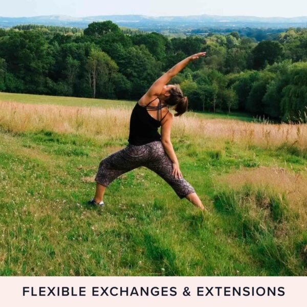 A person in a black tank top and patterned pants performing a yoga pose on a grassy field, surrounded by trees and hills in the background. Text at bottom reads "Flexible Exchanges & Extensions". Embrace forest bathing while finding your inner peace with our Nature and Wellness Day with Yoga, Forest Bathing, and Foraging for Two.