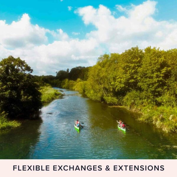 Two individuals in green kayaks glide down a river bordered by verdant trees, under a sky dotted with clouds, evoking the tranquility of the Edinburgh Coast. The bottom text reads, "Mindful Sea Swimming for Two on the Edinburgh Coast – Flexible Exchanges & Extensions.