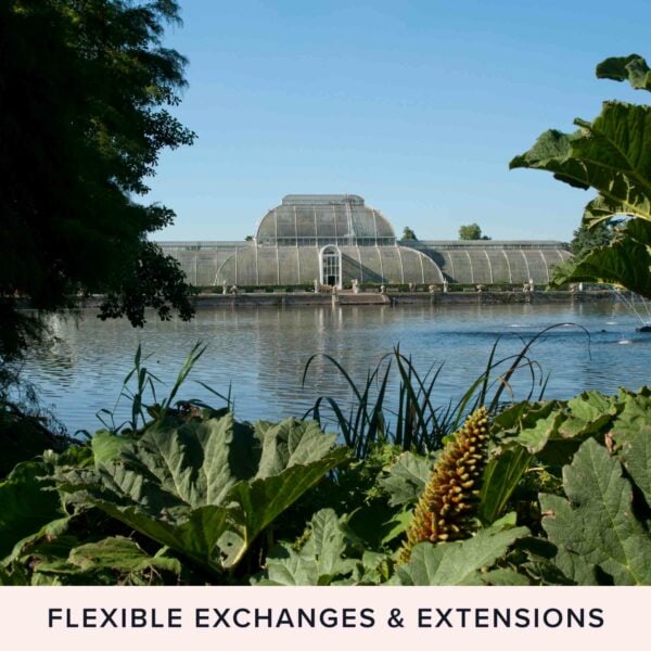 Across a pond, a picturesque conservatory greenhouse nestles amid lush greenery and flourishing plants. Text at the bottom reads, "Flexible Exchanges & Extensions." Enjoy a leisurely afternoon with Prosecco or immerse yourself in our hands-on **Terrarium Workshop with Prosecco for Two**.