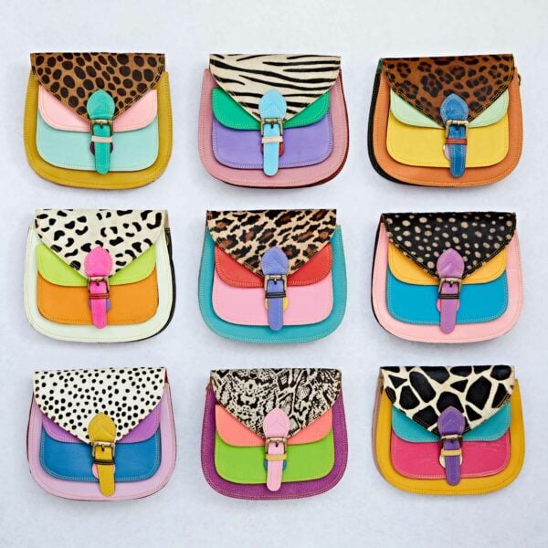 Nine Multicoloured Saddle Crossbody Bags with various animal prints and vibrant color combinations, arranged in a 3x3 grid.