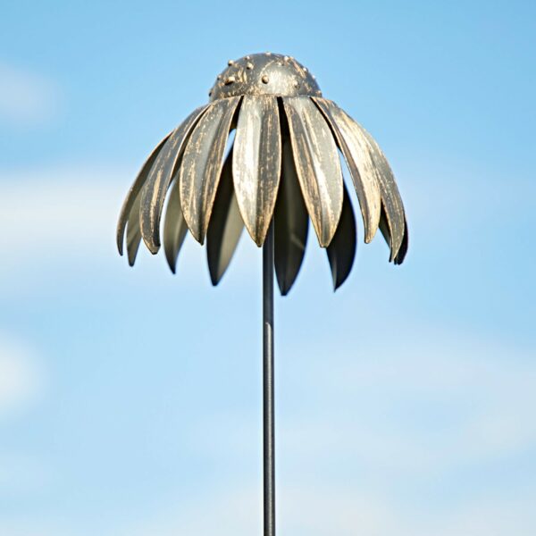 The Metal Echinacea Flower Garden Stake Decoration features elongated petals reaching skyward, creating a stunning garden accent.
