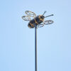 The Recycled Metal Bee Garden Stake features a metal bee with wire wings, crafted from recycled materials and set atop a tall pole—ideal for adding unique charm to your garden decor.