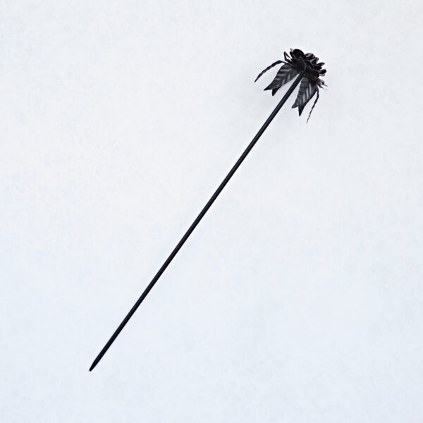 The Recycled Iron Black Rose Garden Stake, featuring a decorative black ribbon and bow, is photographed on a plain white background.