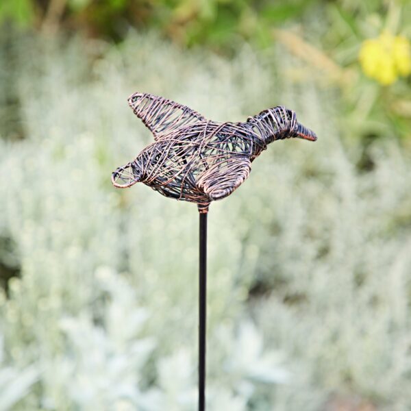 The Recycled Wire Duck Garden Stake Decoration, crafted from recycled wire, features a duck perched on a metal rod—an eco-friendly accent for your garden.