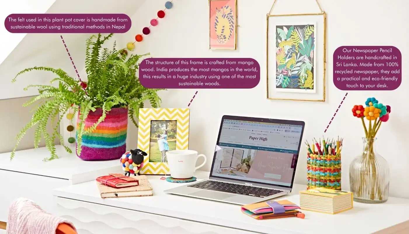 The Ultimate Sustainable Home Office Setup: A colorful desk features a laptop, plant, mug, and various handmade sustainable decor items, including felt, wood, and recycled newspaper pencil holders.