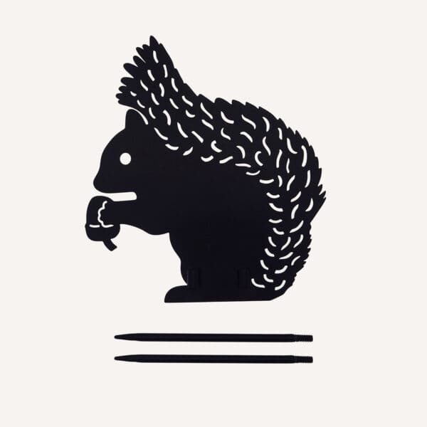 The Recycled Metal Squirrel Silhouette Garden Stake features a black squirrel holding an acorn, with two sturdy stakes for easy display, shown on a plain background.