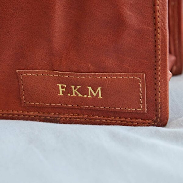 Personalised Brown Leather Messenger Bag (Copy) featuring a rectangular patch with gold 